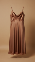 A Cozy Elegance silk blend sleep dress is centered against a neutral Earthy Cocoa background. The dress is perfectly...
